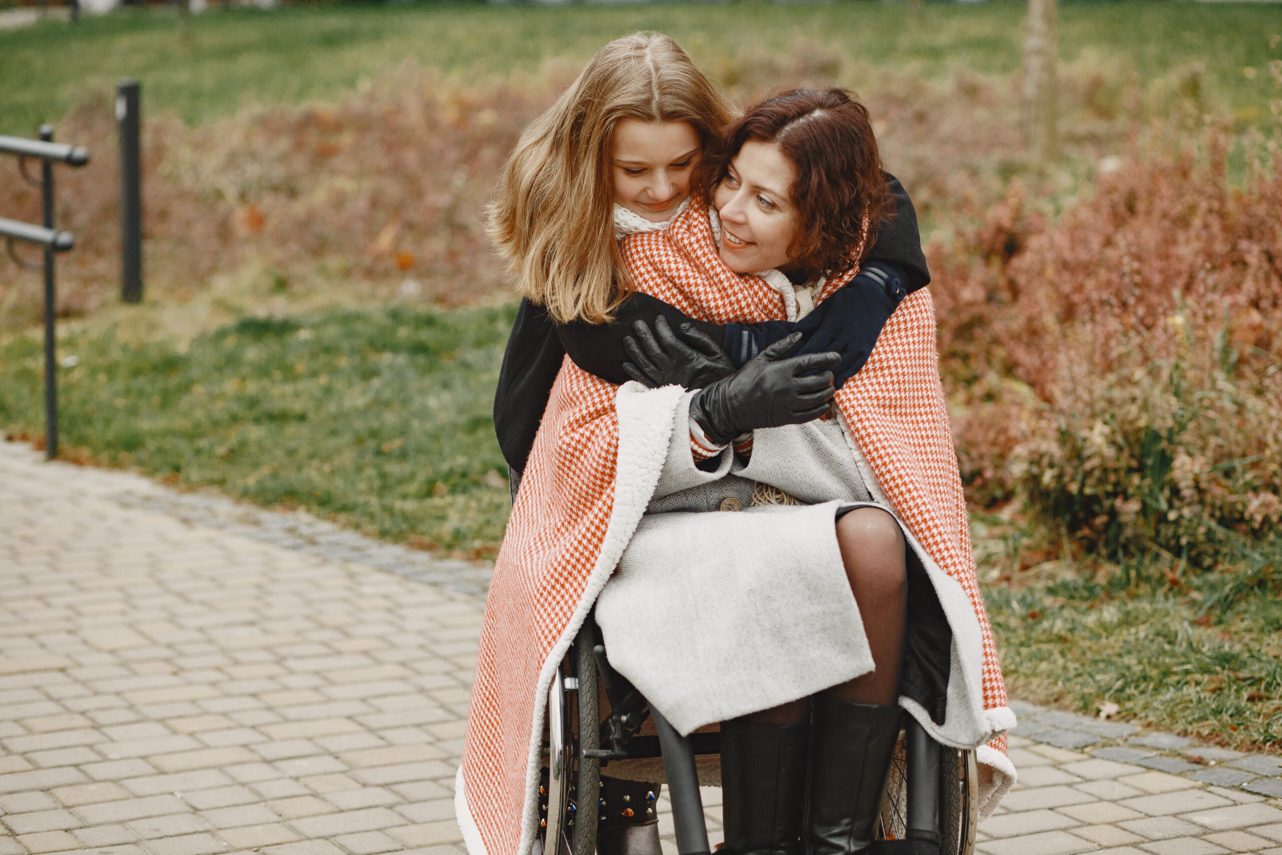 Young Carer looking after her mum in a wheelchair