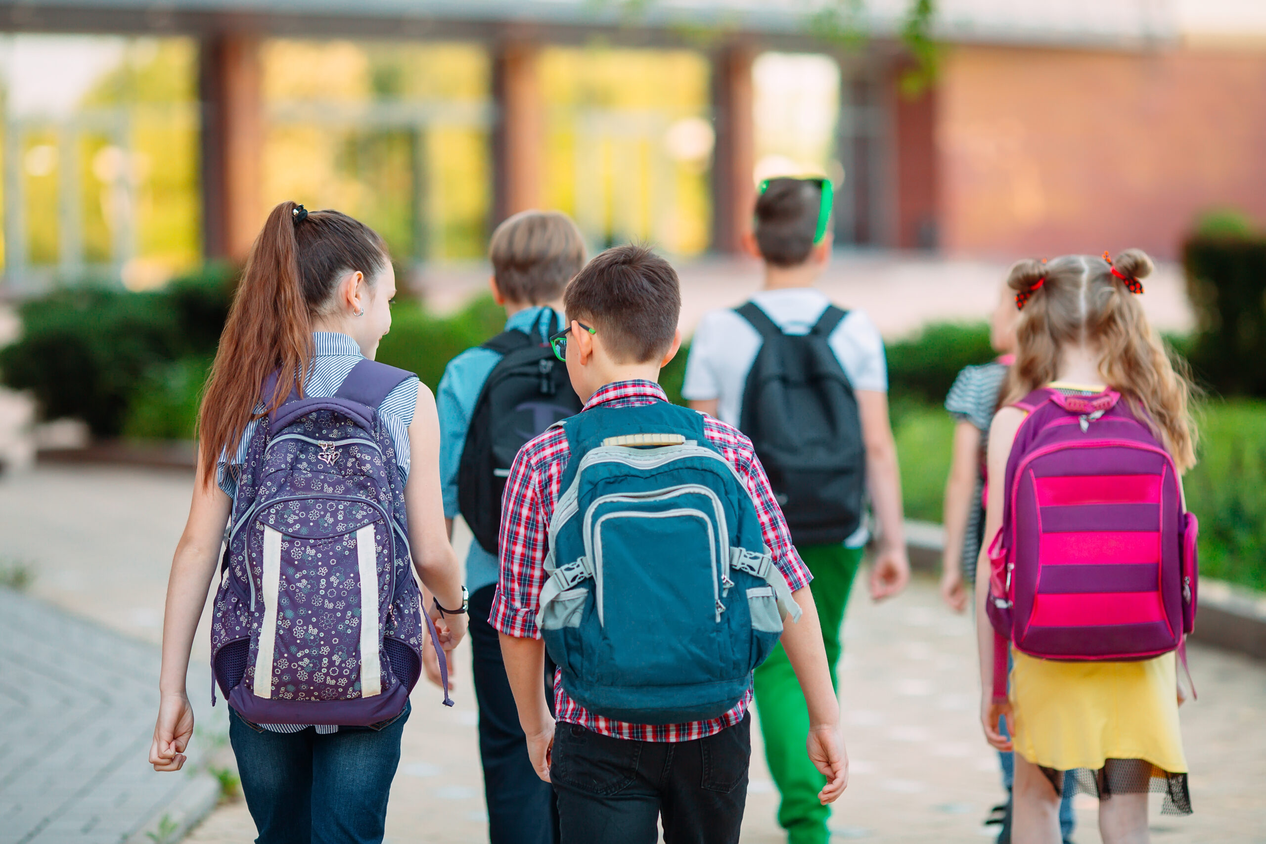 children with backpacks on